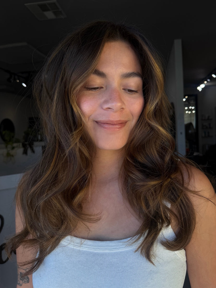 Dimensional brunette hair with face-framing pieces by Dom Dallas at Hair Los Angeles