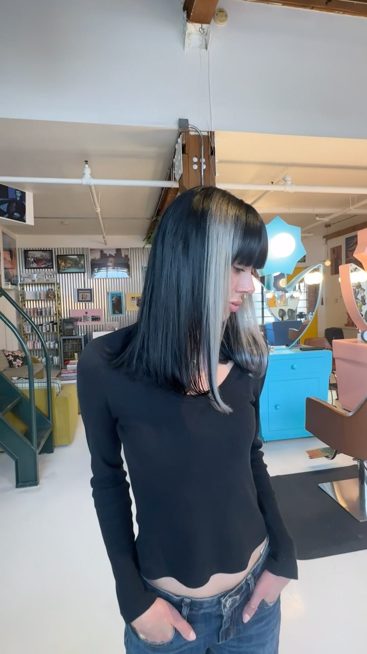Dark bob with pale face-framing chunky highlights and blunt fringe by Ella Park at Hair Los Angeles