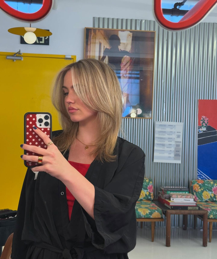 Dimensional blonde highlights and lowlights with layered styling by Kayla Casey